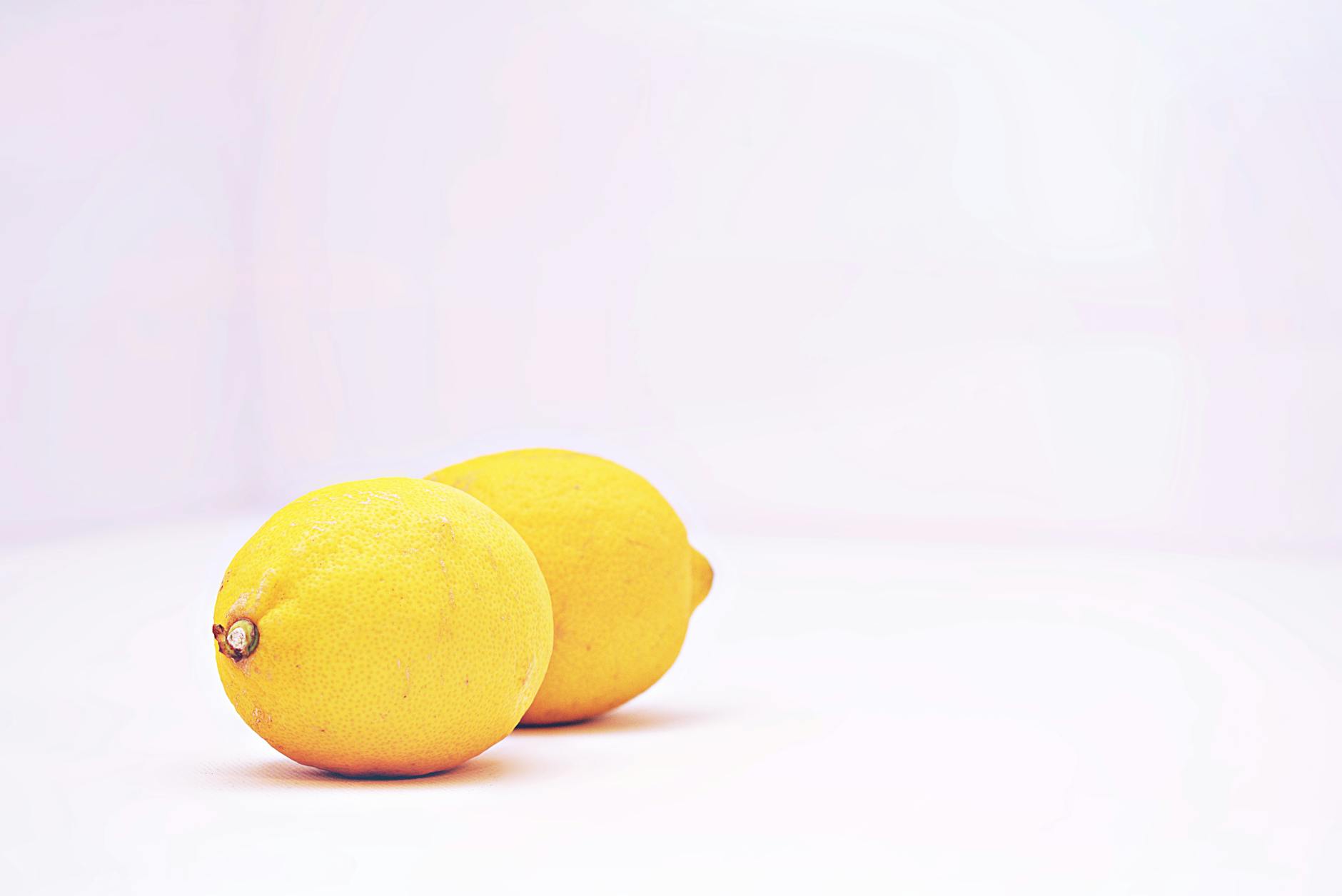 A blue vibrator surrounded by flowers on a bright yellow background, symbolizing sensual reconnection